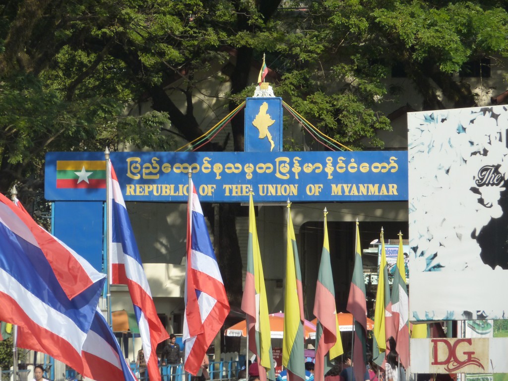 a group of flags outside of a building