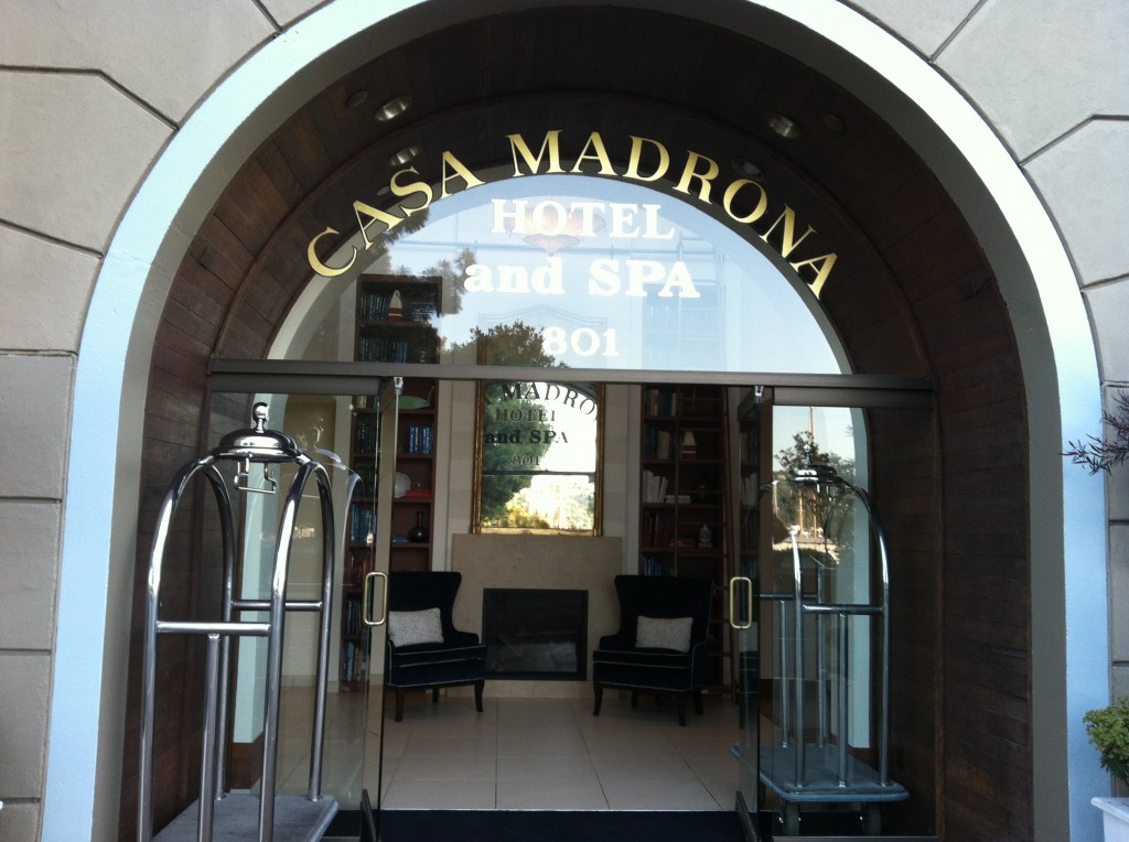 a hotel entrance with a glass door