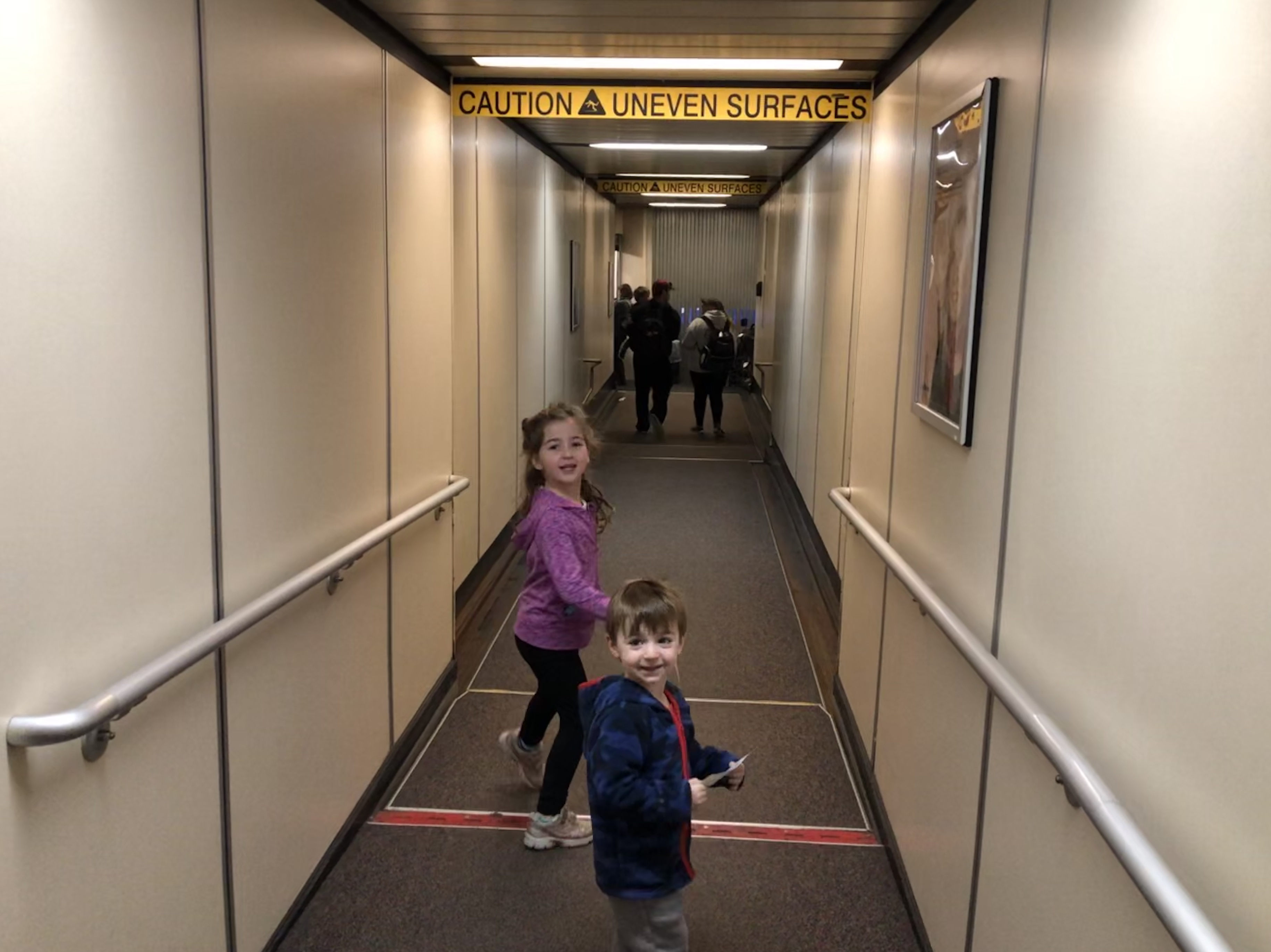 a couple of kids in a hallway